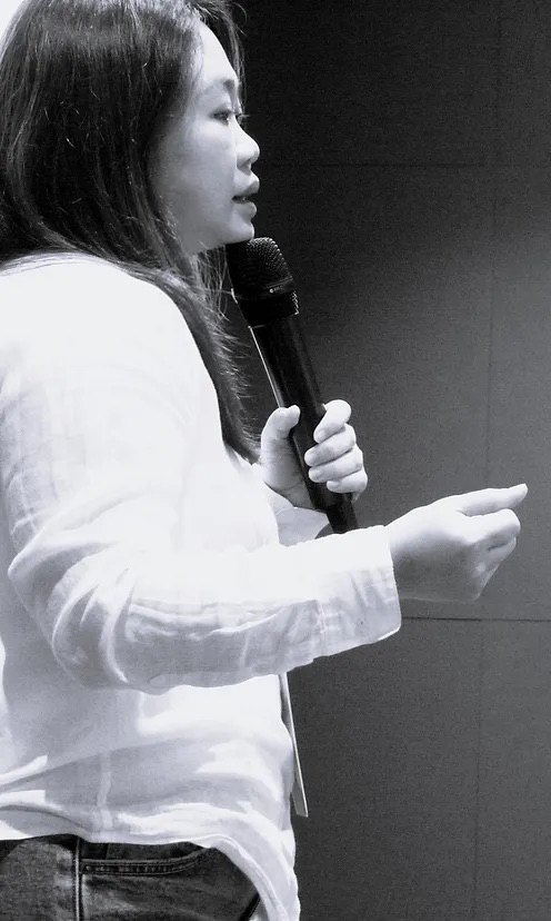 Empathic Agility co-founder Serena speaking on stage at a conference